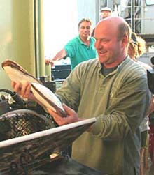 Co-Chief Scientist Tim Shank delightedly removes clams from Alvin's basket Co-Chief Scientist Tim Shank delightedly removes clams from Alvin's basket