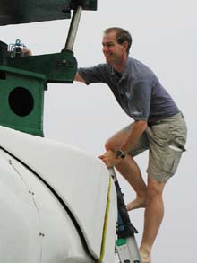 Frank Parrish climbing into the Pisces IV sub