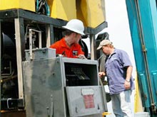 Lucas Cribley and Geoff Ellett making adjustments to the ROV.