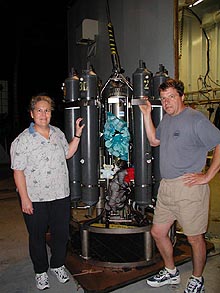 Geoff, Sharon and the backpack buddies are checking to make sure the mesh bags with the cups are secure to the CTD frame before putting them into the water