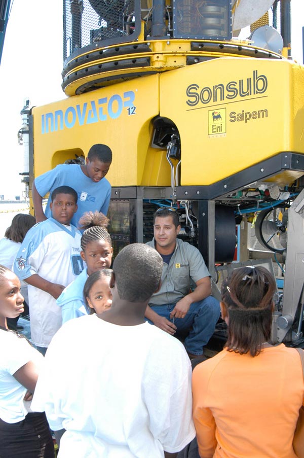 Sonsub technician, Ray Maza, speaks with students