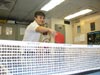 Nicolas Alverado hits a winner at the ping pong table.