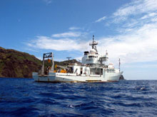 The R/V Thomas G. Thompson holding station over Maug caldera.