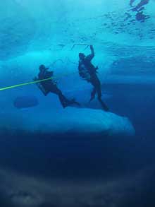 The fresh fallen snow accumulates in bands on the open water.