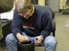 Chris Nicholson repairs a leak in the High Definition camera housing by re-sealing the dome.