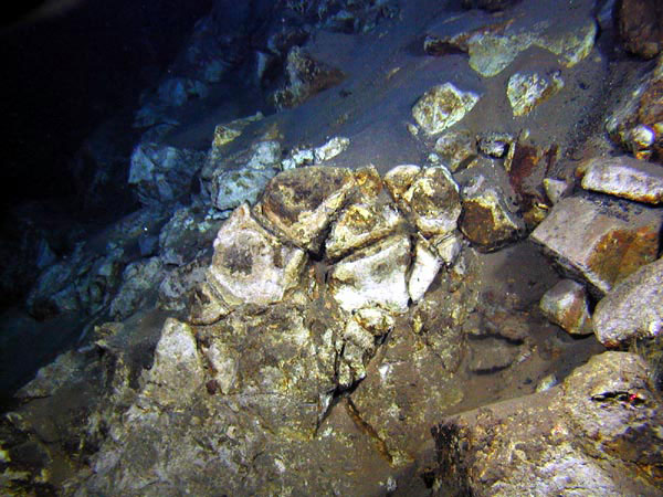 Rocks that have been totally altered by hot (hydrothermal) fluids.