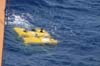 The ROV Hercules is oriented back to back with the ship while the ROV Argus is lifted in to the water.