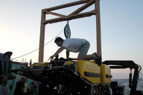 Brennan Phillips of IFE looking over the ROV Hercules, post dive