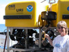 Susan Mills retrieves a settlement block from the ROV Hercules.