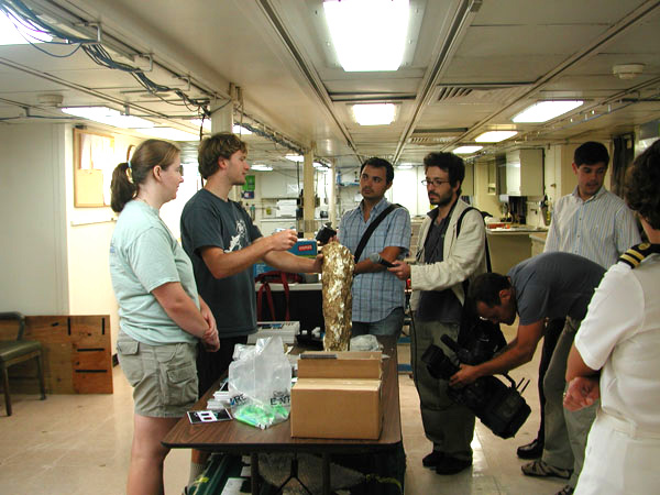 Kate Buckman and Giora Proskurowski , both of the Woods Hole Oceanographic Institution, describe the science associated with the Lost City hydrothermal vent fields and a partial chimney from the vent fields to the Azorian press.