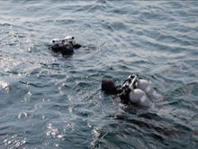 NOAA Divers Joe Hoyt and Russ Green prepare to collect groundwater and 
deploy chambers