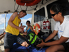 Todd Hallenbeck, Krystle Gomez and Alexis Hall work together to prepare the ROV for launch and exploration.