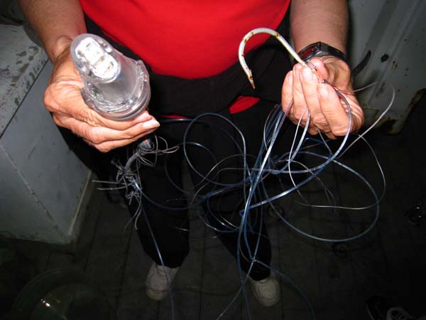 The mysterious lure and hook that was recovered next to the capsized EITS. 