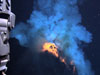 Superheated molten lava, about 2200 degrees Fahrenheit, is about to explode into the water in this image. The area in view is about 6-10 feet across.