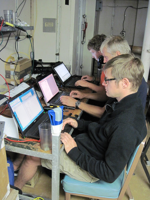 ROV pilots work from video science lab to communicate with pilots in ROV control van on the deck of the R/V Roger Revelle.