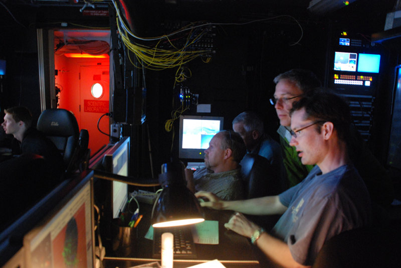 Archaeologists Jimmy Moore, Frank Cantelas, Rod Mather, and Gordon Watts conduct reconnaissance on the first shipwreck from the ROV van.