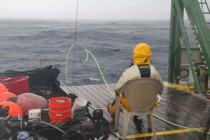 ROV pilot Lance Horn keeps a lonely vigil on the aft deck