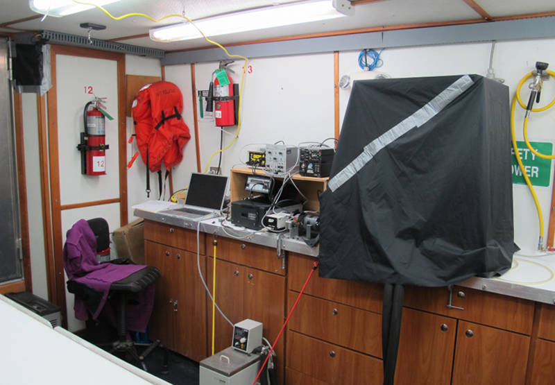 Fig. 2 - A view of the wetlab aboard the <em>R/V Pelican</em> after equipment setup.