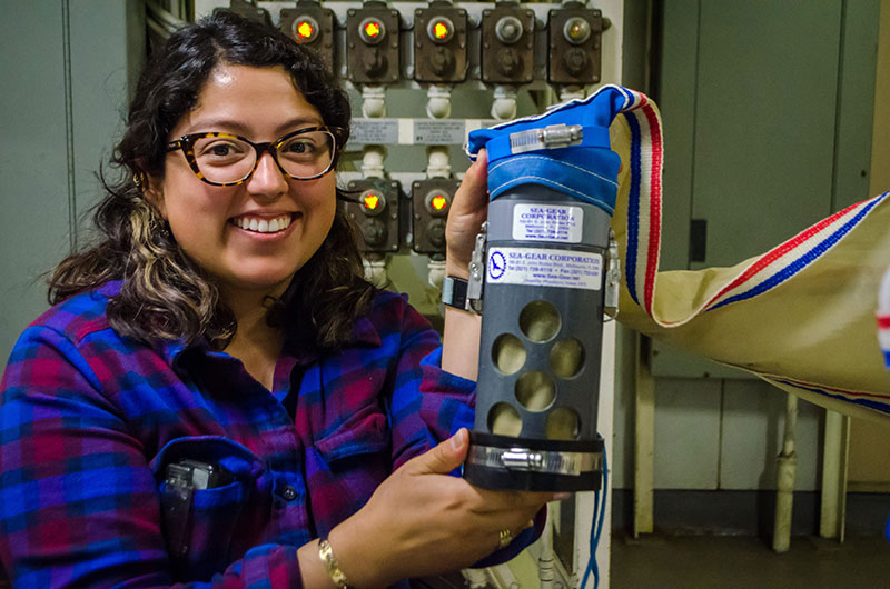 Heidi Mendoza-Islas prepares a net to collect plankton from the water column.