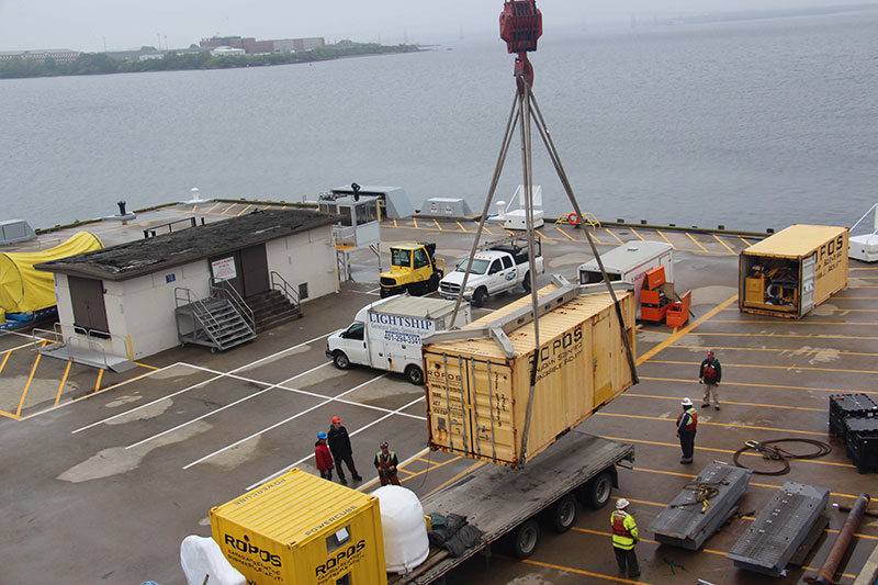 The container destined for the 01 deck is lifted off the truck. 