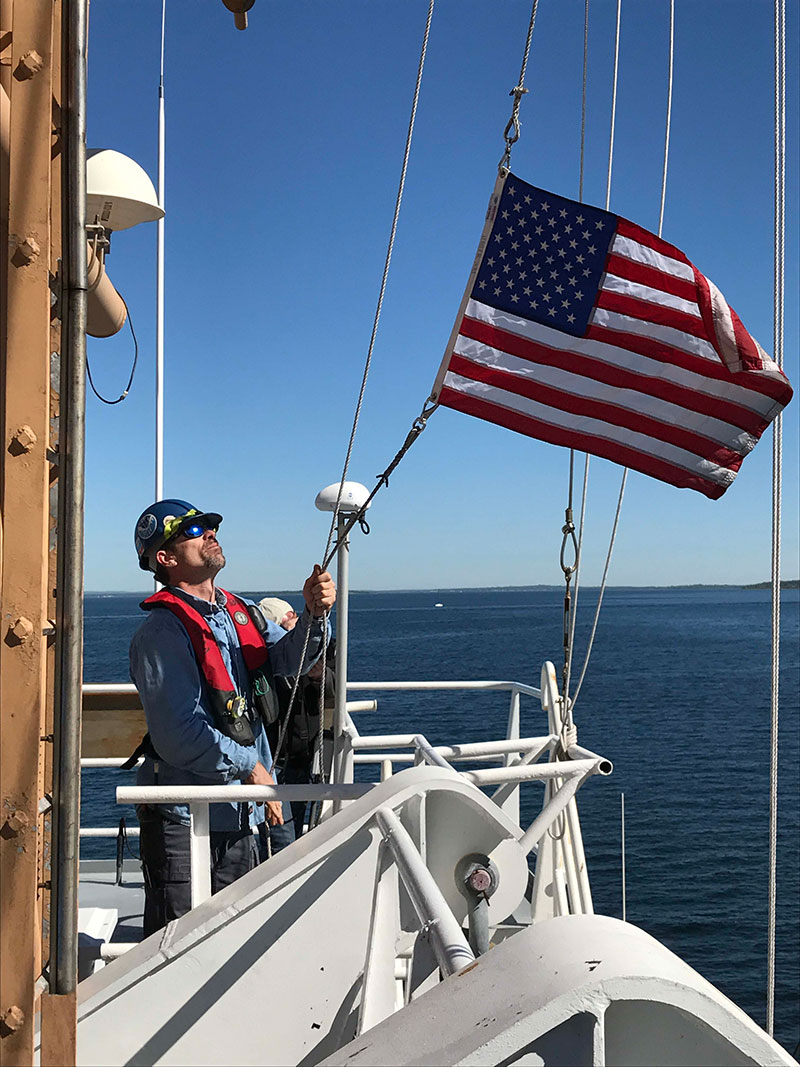 Raising the flag while we get underway.