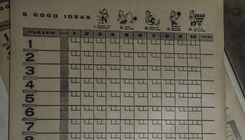 Keeping score at the Midway bowling alley.