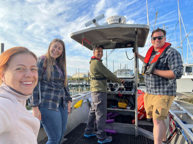 Researchers preparing Research Vessel Minnow for operations.