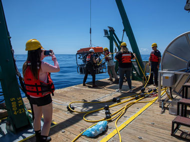 Harbor Branch Oceanographic Institute’s Courtney Brooks records the launch of the Mohawk remotely operated vehicle during Exploration of Deepwater Habitats off Puerto Rico and the U.S. Virgin Islands for Biotechnology Potential.