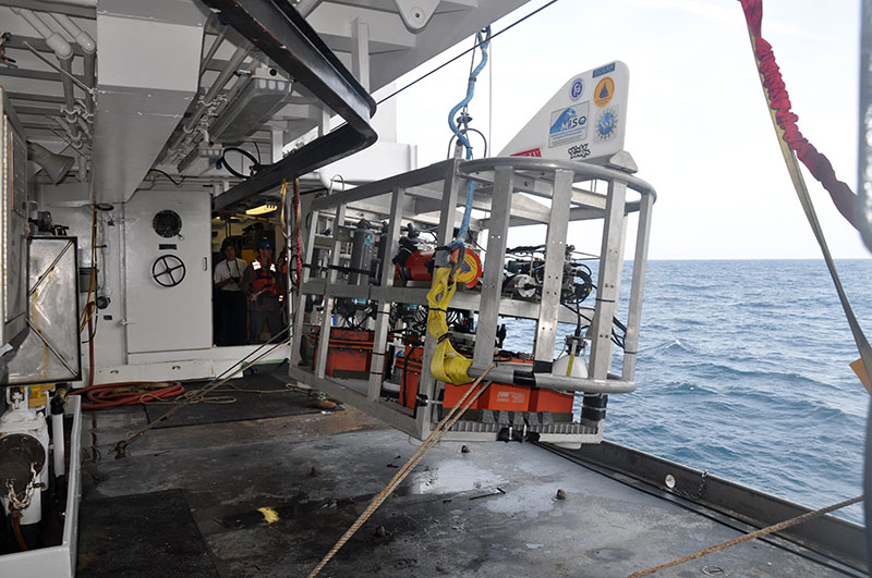 Woods Hole Oceanographic Institution’s TowCam, our “eye in the sea,” lifts off the deck during deployment on the first dive of the cruise.