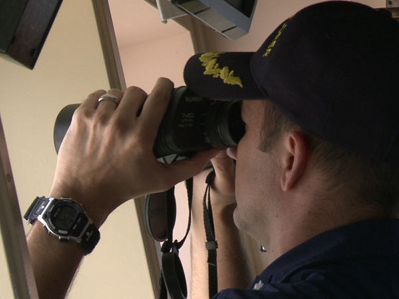 Commanding Officer Robert Kamphaus scans the horizon for contacts.