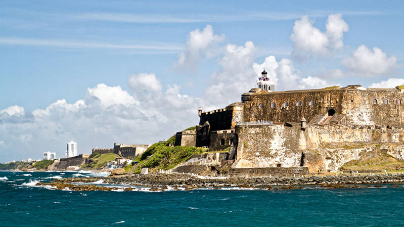 NOAA Ship Okeanos Explorer passes Castillo San Felipe del Morro as she departs San Juan Harbor.