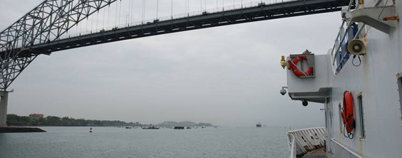 NOAA Ship Okeanos Explorer approaches the Bridge of the Americas, officially leaving the Panama Canal. Okeanos transited through the canal during Leg 1 of Tropical Exploration 2015.