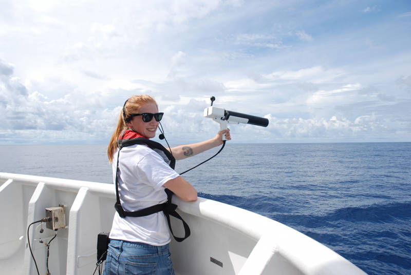 Kate von Krusenstiern, an Explorer-in-Training from Bellingham, Washington, casting an expendable-bathy-thermograph (XBT) off the stern of the ship to measure the temperature of the water column.