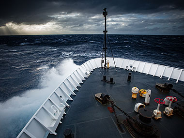 The Okeanos Explorer beats its way into heavy seas.