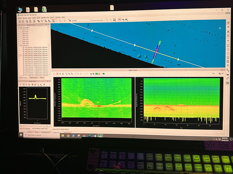 Computer screen displaying sonar data analysis software with maps and graphs.