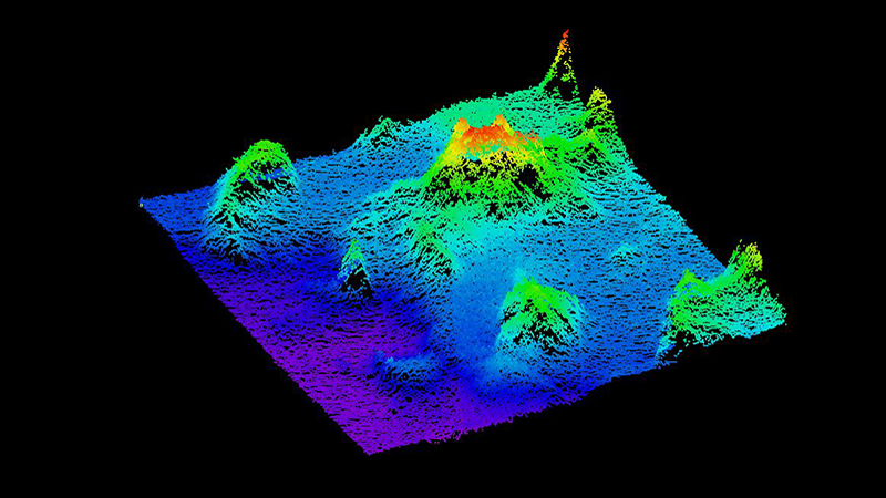 Colorful 3D topographical map with varying elevations in a dark background.