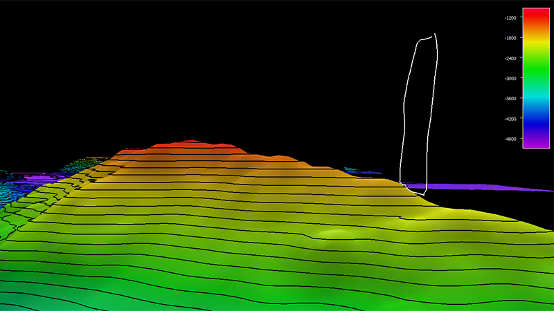 A topographical map with contour lines and a color gradient from green to red indicating elevation changes, against a black background.